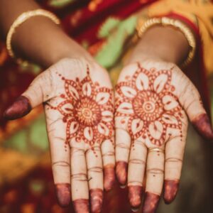 woman showing henna tattoo on her hands
