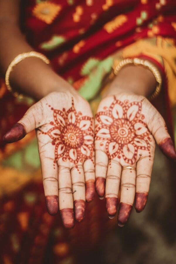 woman showing henna tattoo on her hands