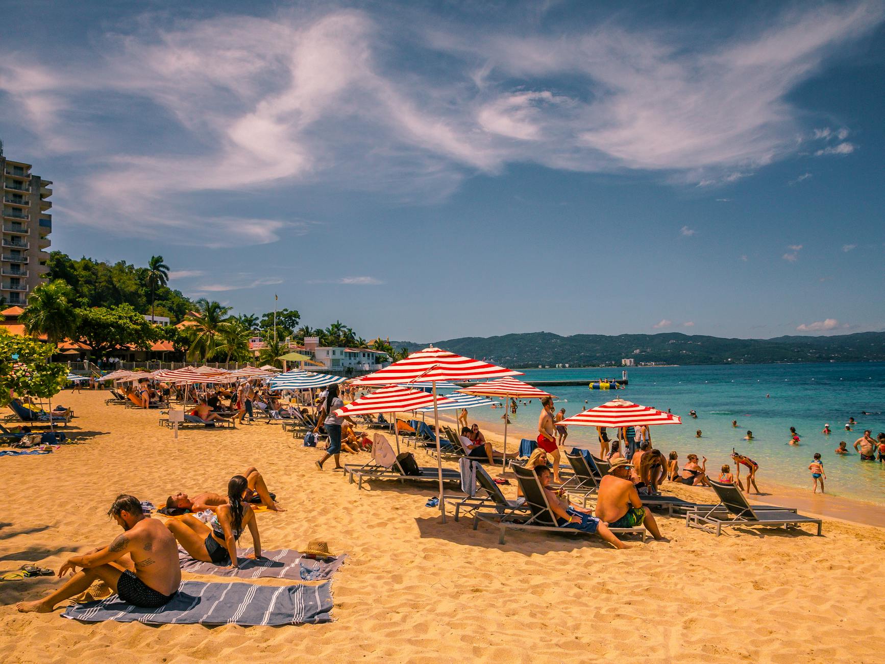 people sunbathing at the beach