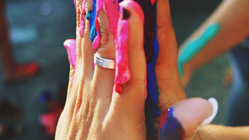 a person holding a small toy in their hands