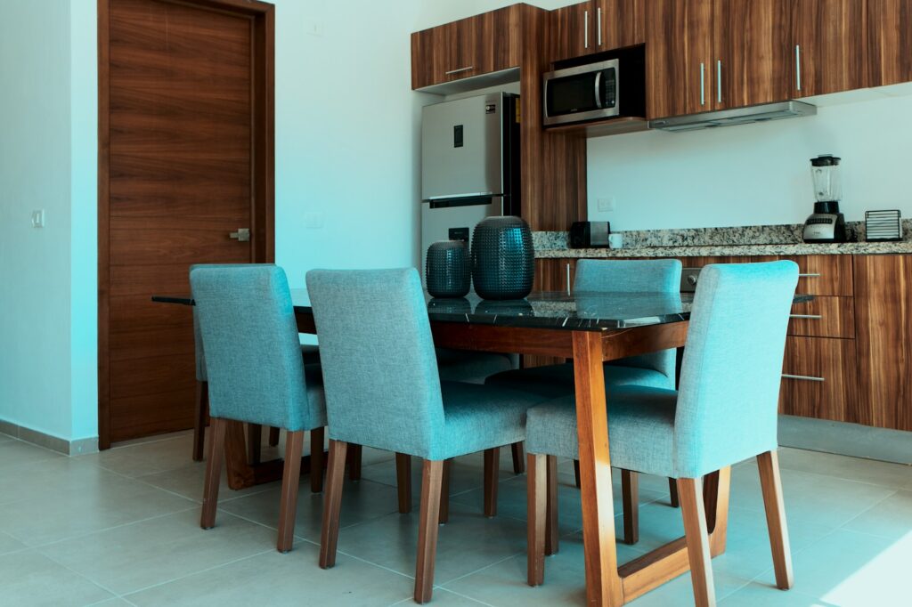 a kitchen with a table and chairs